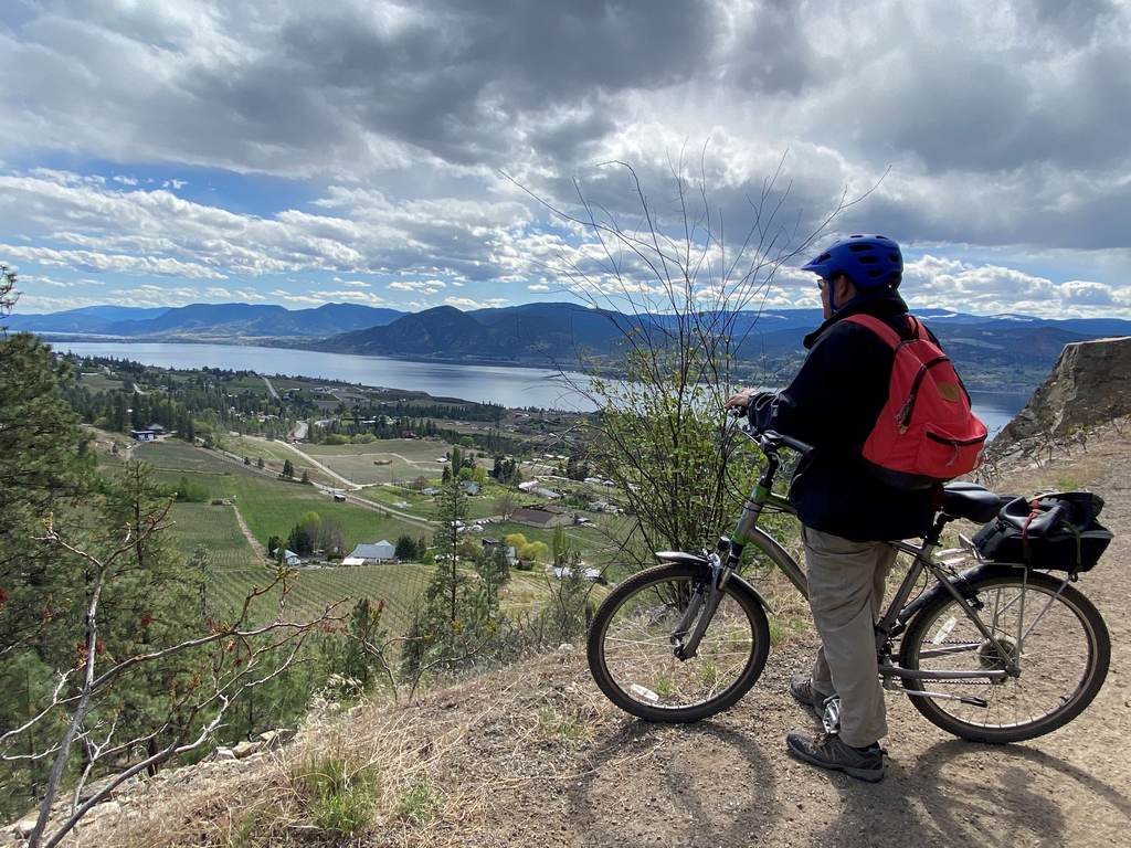 Cyclist overloooking Kelowna Cyclist overloooking Kelowna